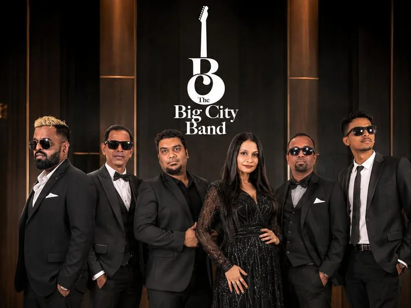 The six members of Big City Band in black suits and an evening gown